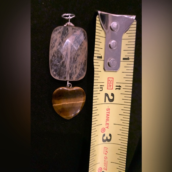 Rutilated quartz and a tigereye heart combine for a striking pendant. 2.75” - Picture 3 of 5